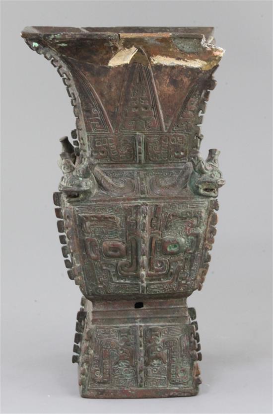 A rare Chinese archaic bronze ritual wine vessel, Fangzun, Shang dynasty, 13th-11th century B.C., 33.5cm high, losses and repairs